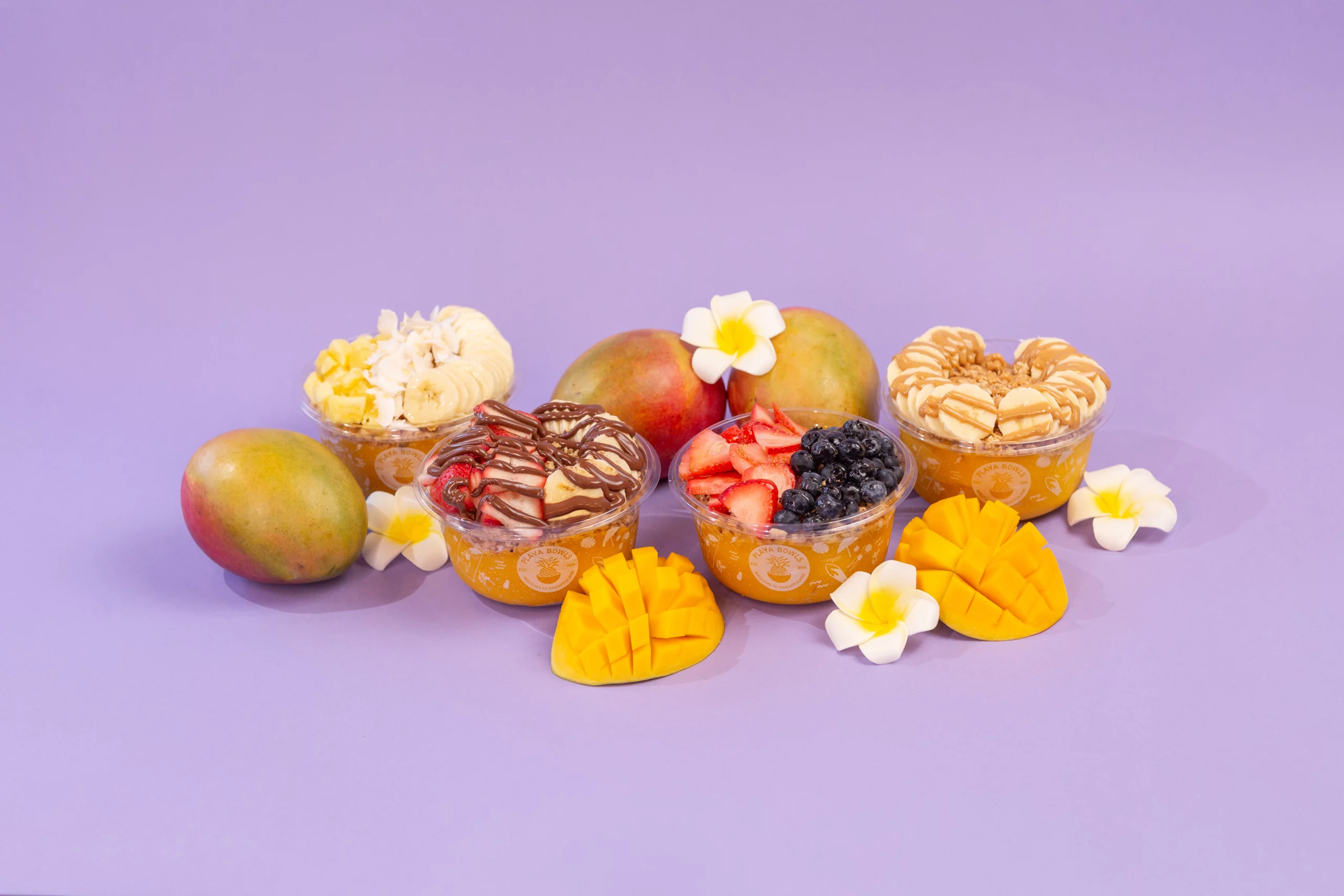 various mango bowls on a decorative purple background